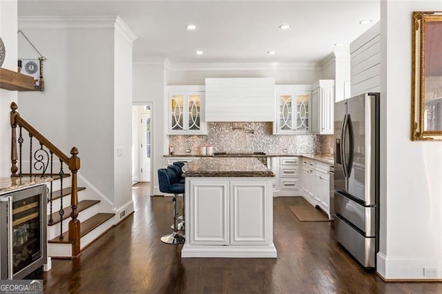 2616 Boddie Pl, Duluth, GA 30097 - kitchen with dark wood-style flooring, glass insert cabinets, beverage cooler, baseboards, and stainless steel fridge with ice dispenser