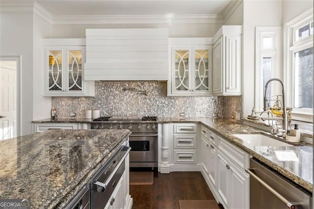 2616 Boddie Pl, Duluth, GA 30097 - kitchen featuring white cabinetry, appliances with stainless steel finishes, a sink, and premium range hood
