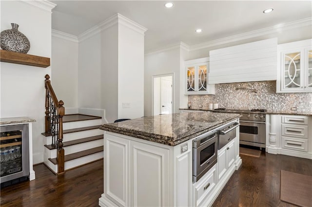 2616 Boddie Pl, Duluth, GA 30097 - kitchen featuring beverage cooler, dark wood-style floors, custom range hood, backsplash, and stainless steel appliances
