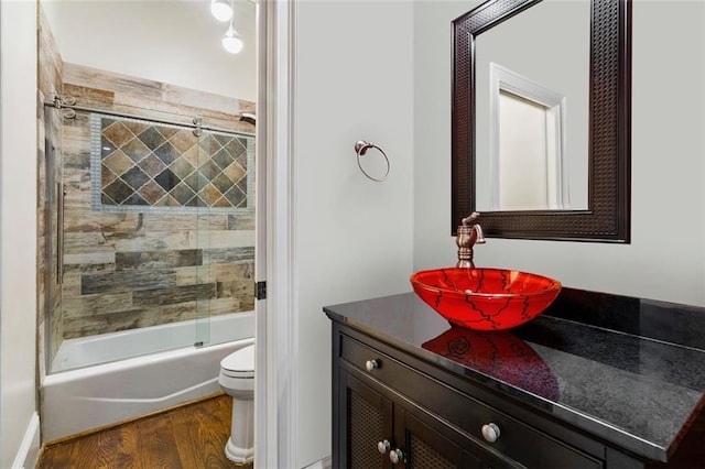 2616 Boddie Pl, Duluth, GA 30097 - bathroom featuring toilet, wood finished floors, shower / bath combination with glass door, and vanity