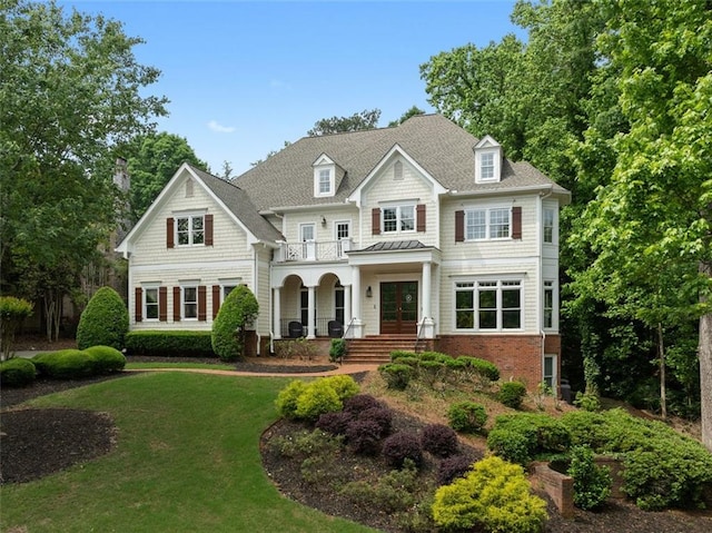2616 Boddie Pl, Duluth, GA 30097 - view of front facade with french doors, covered porch, a front lawn, and a balcony