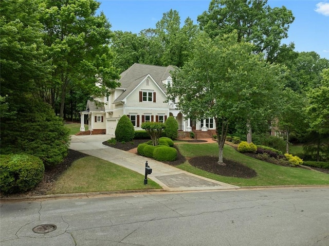 2616 Boddie Pl, Duluth, GA 30097 - view of front of property featuring a garage, concrete driveway, and a front lawn