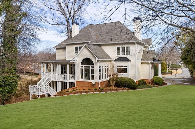 2616 Boddie Pl, Duluth, GA 30097 - back of house with a chimney, a standing seam roof, a shingled roof, a yard, and stairway