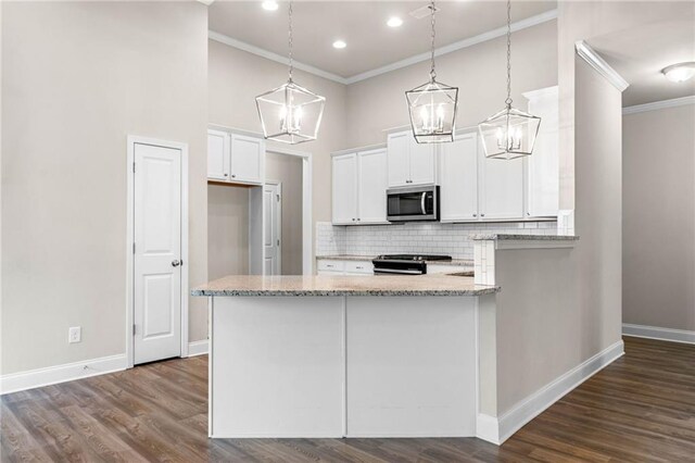 8230 Dawson View Way, Cumming, GA 30028 - kitchen featuring crown molding, light stone countertops, stainless steel appliances, and a notable chandelier
