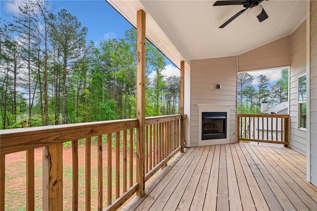 8230 Dawson View Way, Cumming, GA 30028 - wooden deck with a large fireplace and ceiling fan