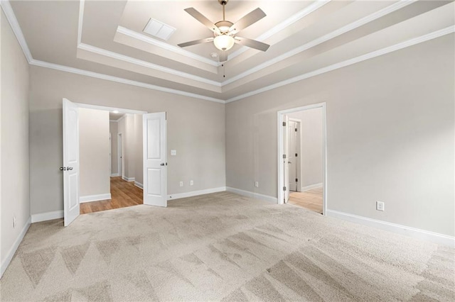 8230 Dawson View Way, Cumming, GA 30028 - unfurnished room featuring a ceiling fan, visible vents, light colored carpet, ornamental molding, and a tray ceiling