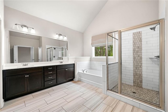 8230 Dawson View Way, Cumming, GA 30028 - bathroom featuring double vanity, a stall shower, a garden tub, and a sink