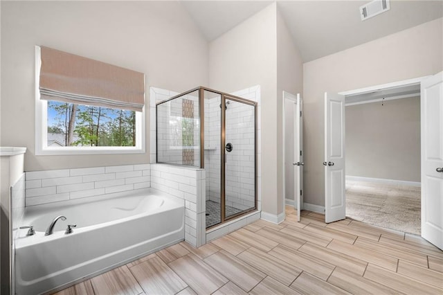 8230 Dawson View Way, Cumming, GA 30028 - full bathroom with visible vents, lofted ceiling, a garden tub, and a shower stall