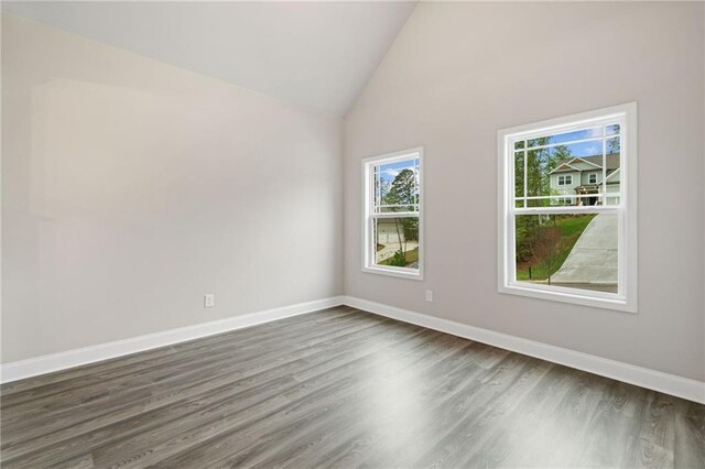 8230 Dawson View Way, Cumming, GA 30028 - unfurnished room with baseboards, dark wood-style flooring, and high vaulted ceiling