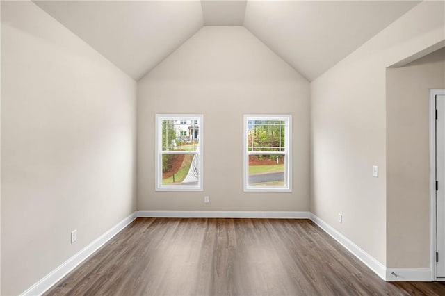 8230 Dawson View Way, Cumming, GA 30028 - empty room featuring baseboards, dark wood-style floors, and vaulted ceiling