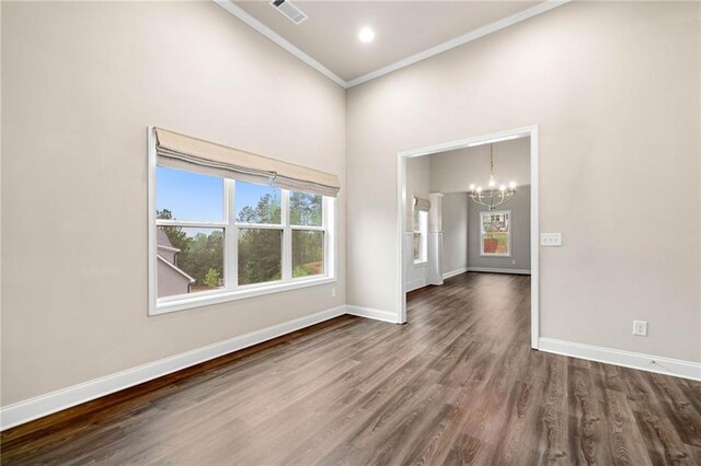 8230 Dawson View Way, Cumming, GA 30028 - empty room featuring visible vents, crown molding, baseboards, dark wood-type flooring, and a chandelier