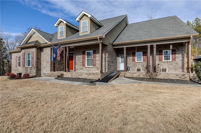 view of front of property with a porch and a front yard