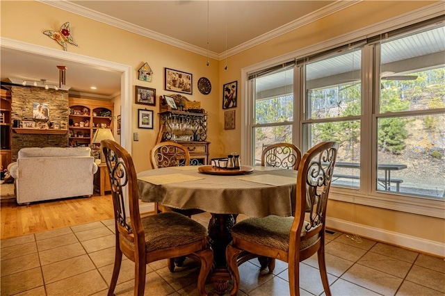 tiled dining area with built in shelves and ornamental molding