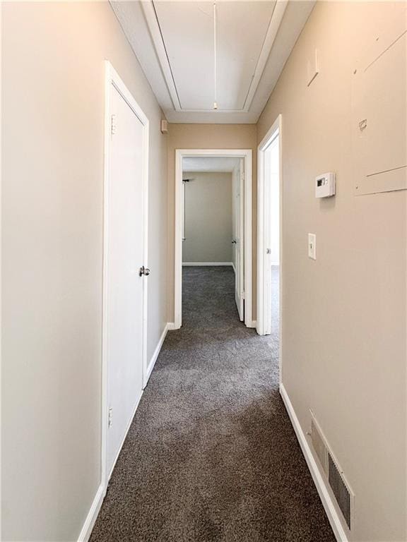 corridor with dark colored carpet