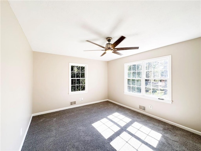 carpeted empty room featuring ceiling fan