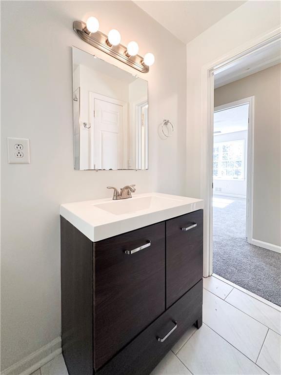 bathroom with vanity and tile patterned flooring