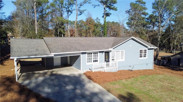 single story home featuring a carport