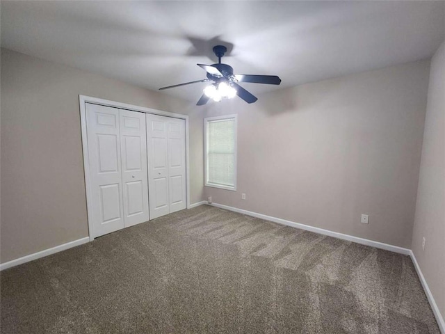 unfurnished bedroom featuring a closet, ceiling fan, and carpet