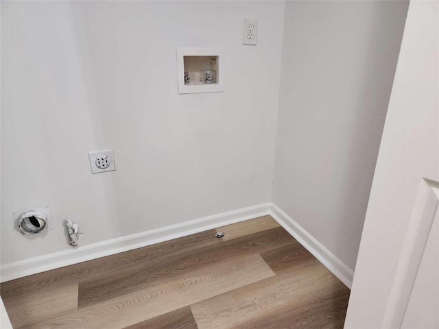 laundry area featuring hookup for a gas dryer, hookup for an electric dryer, hardwood / wood-style flooring, and hookup for a washing machine