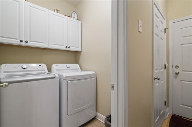 laundry area with cabinets and independent washer and dryer