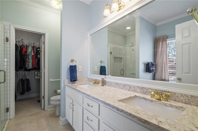 bathroom featuring tile patterned flooring, vanity, an enclosed shower, toilet, and crown molding