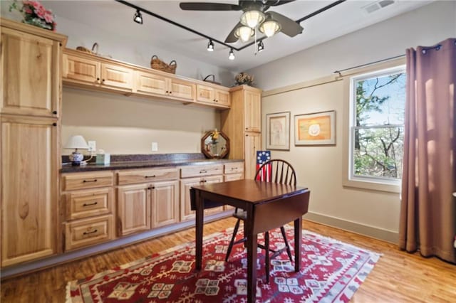 office area with ceiling fan, rail lighting, and light hardwood / wood-style floors