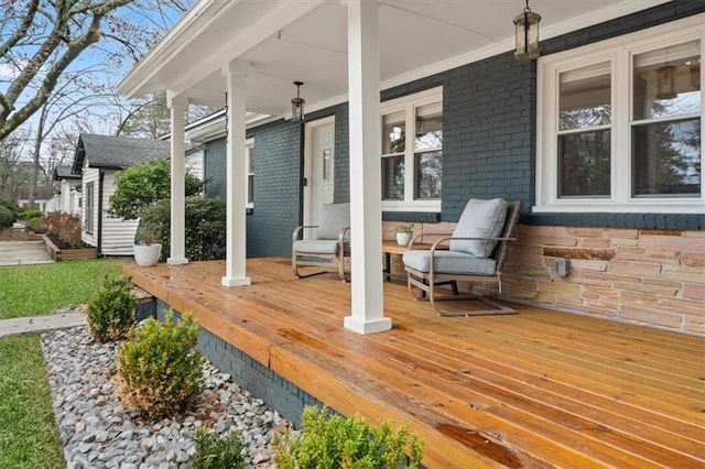 wooden deck featuring covered porch