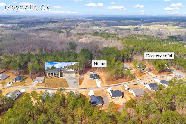 drone / aerial view with a view of trees