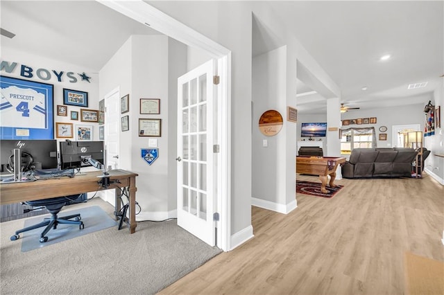 office with visible vents, ceiling fan, baseboards, and wood finished floors