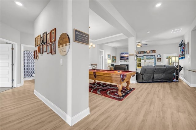 hallway featuring recessed lighting, visible vents, baseboards, and light wood-style floors