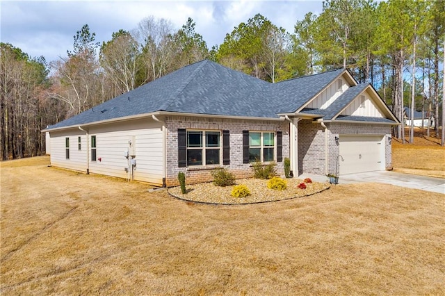 craftsman-style house with brick siding, an attached garage, concrete driveway, and a front yard