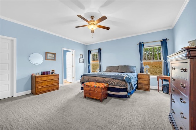 bedroom featuring crown molding, baseboards, carpet floors, and ceiling fan