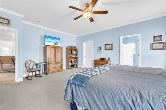 bedroom featuring ceiling fan, baseboards, carpet floors, and ornamental molding