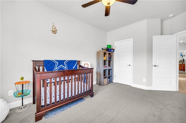 carpeted bedroom with baseboards and ceiling fan