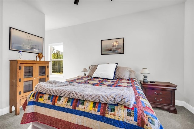 bedroom featuring ceiling fan, baseboards, and carpet floors