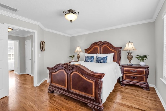 420 Heritage Park Trce NW Unit 22, Kennesaw, GA 30144 - bedroom featuring wood finished floors and crown molding