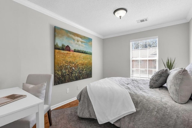 420 Heritage Park Trce NW Unit 22, Kennesaw, GA 30144 - bedroom with ornamental molding, a textured ceiling, and wood finished floors