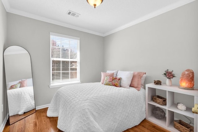 420 Heritage Park Trce NW Unit 22, Kennesaw, GA 30144 - bedroom with crown molding and wood finished floors