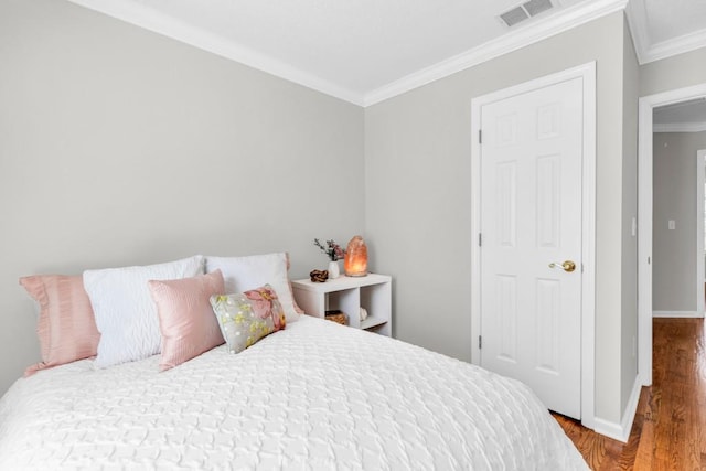 420 Heritage Park Trce NW Unit 22, Kennesaw, GA 30144 - bedroom with ornamental molding and wood finished floors