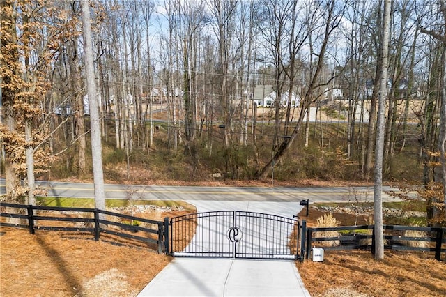 view of gate featuring fence