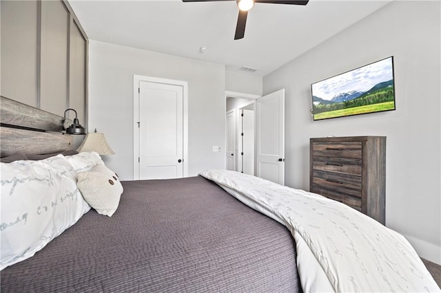 bedroom with visible vents and a ceiling fan