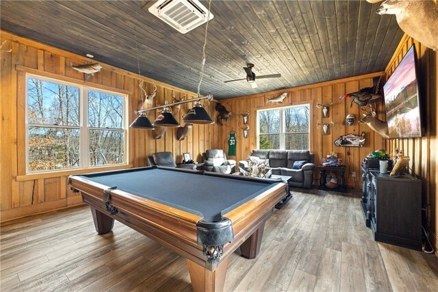 playroom with wooden ceiling, visible vents, wooden walls, and wood finished floors