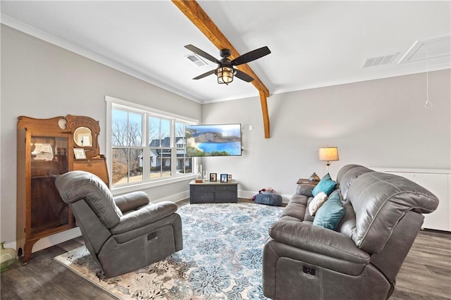 living room featuring visible vents, baseboards, dark wood-style floors, beamed ceiling, and attic access