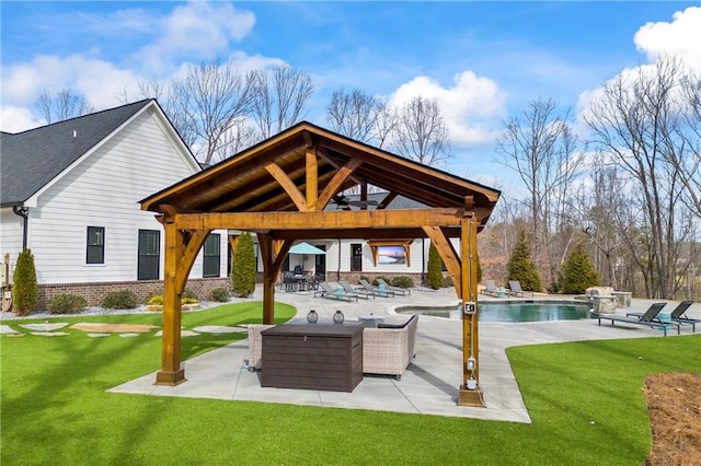 exterior space with an outdoor pool, a patio area, a lawn, and a gazebo