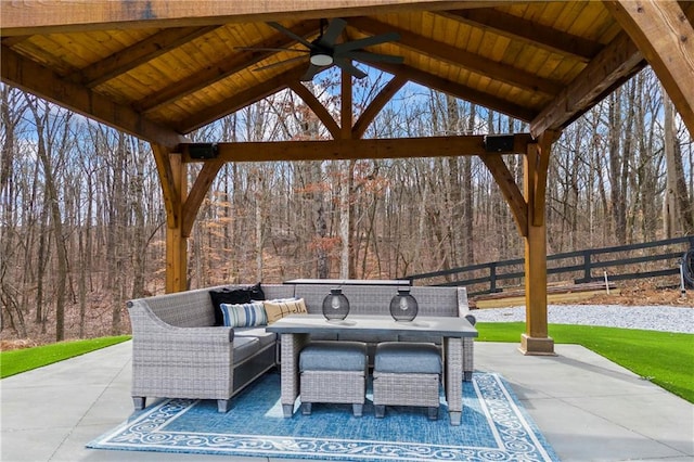 view of patio / terrace featuring fence and a ceiling fan