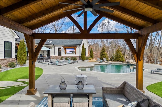 pool with outdoor dining area and a patio area