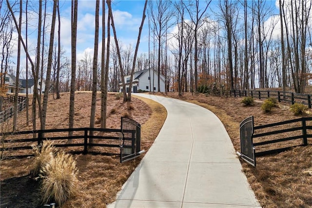 view of community featuring fence