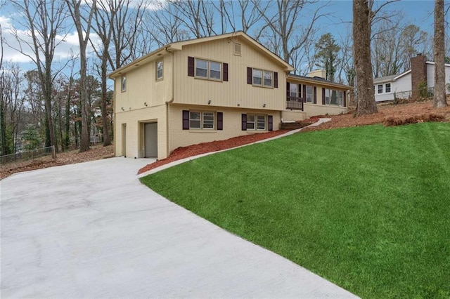 1573 Deerwood Ln, Acworth, GA 30102 - back of house with a lawn, a sunroom, and a garage