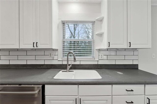 1573 Deerwood Ln, Acworth, GA 30102 - kitchen with tasteful backsplash, dishwasher, white cabinets, and sink