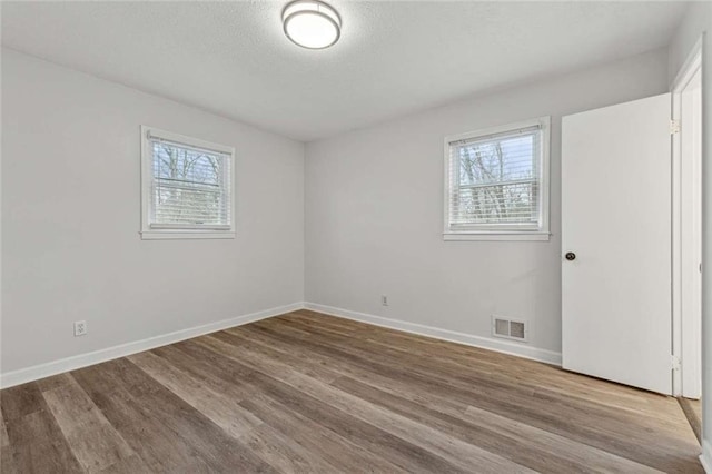 1573 Deerwood Ln, Acworth, GA 30102 - empty room featuring plenty of natural light and wood-type flooring